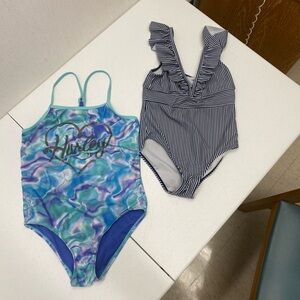 Lot of 2 little girl swimsuits one is size 7/8,  other one is smaller (4/5)
